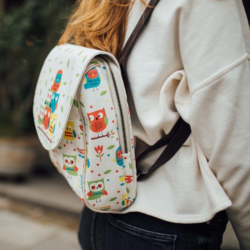 woman-colorful-owls-beige-backpack