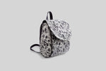 woman-black-and-white-flowers-backpack