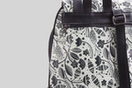 woman-black-and-white-flowers-backpack