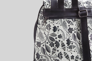 woman-black-and-white-flowers-backpack