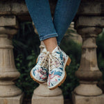 woman-flowers-on-green-short-boots